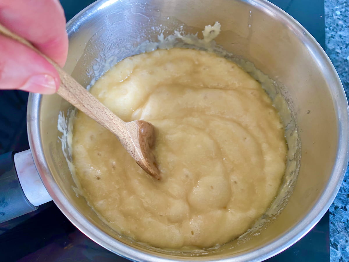 butter and sugar moussing up in a saucepan