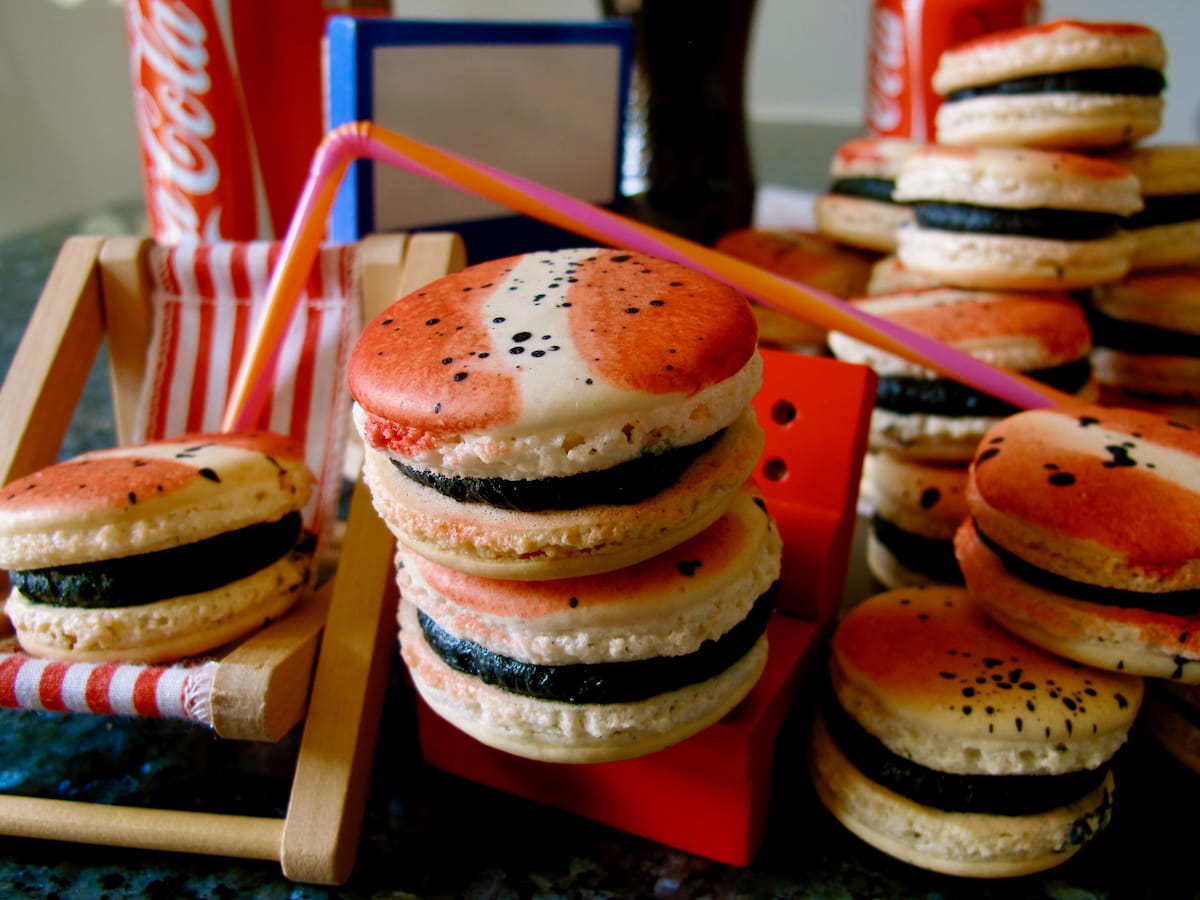 red, white and black cola macarons with straw and deckchair