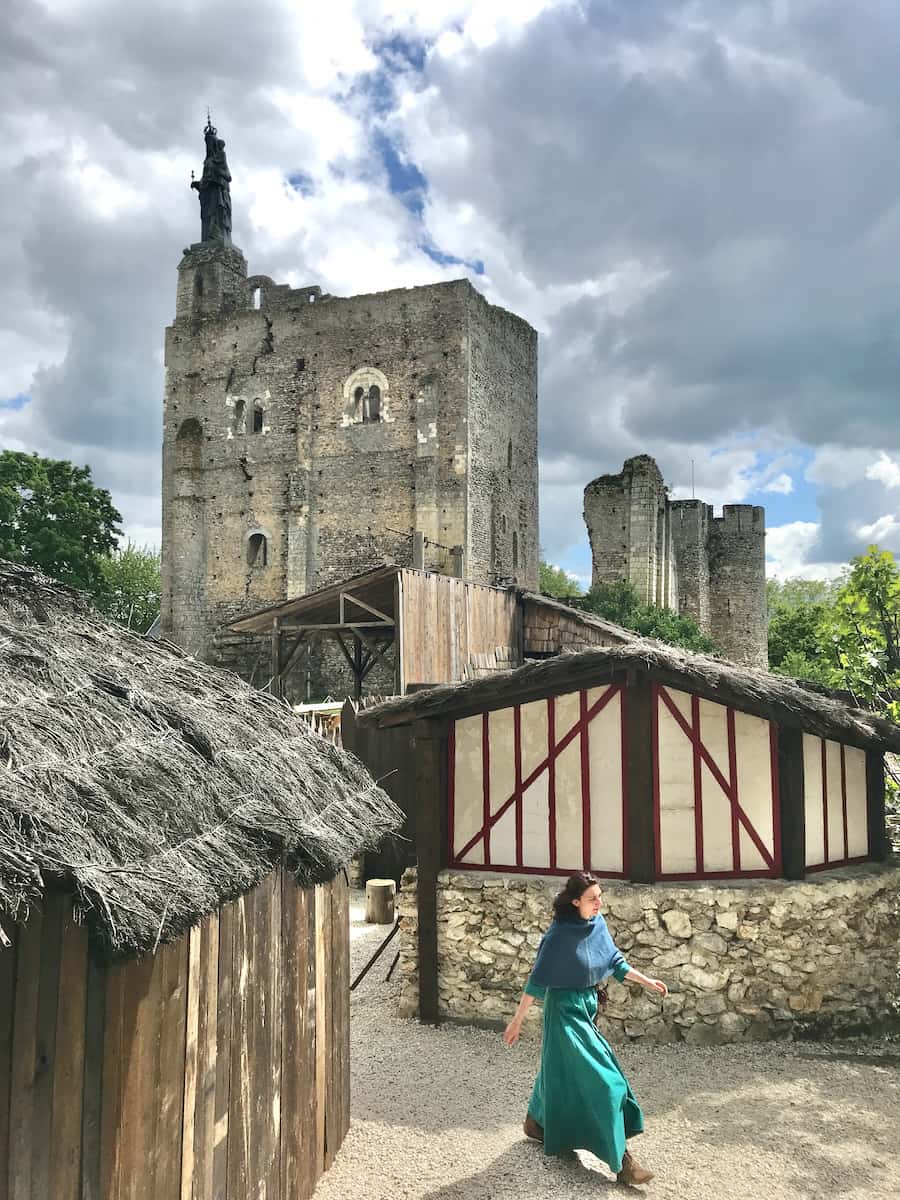 medieval fortress with woman in period costume