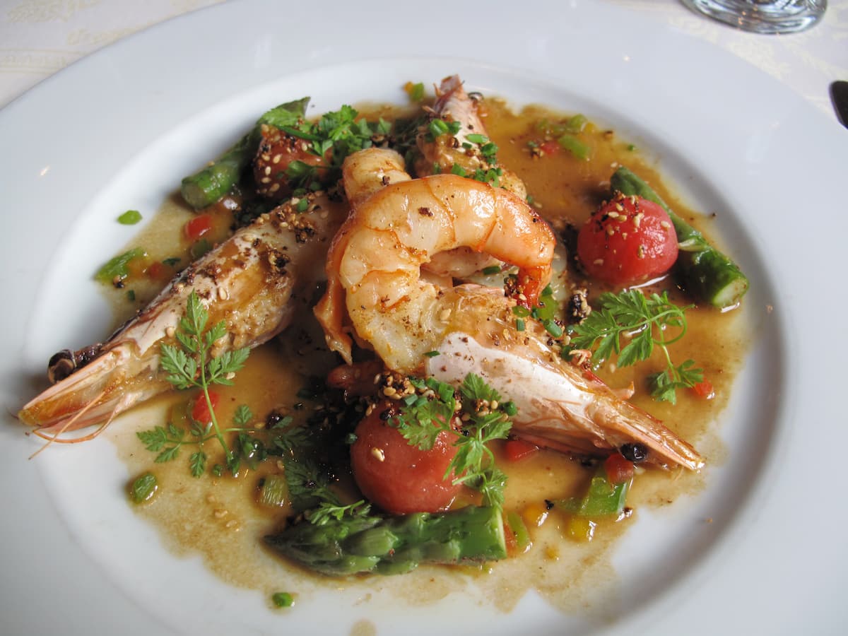 plate of prawns, herbs and roasted tomatoes