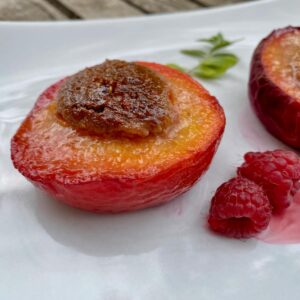 baked peach without skin and stuffed with a mixture of amaretti or almonds and raspberries