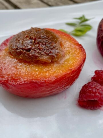 baked peach without skin and stuffed with a mixture of amaretti or almonds and raspberries