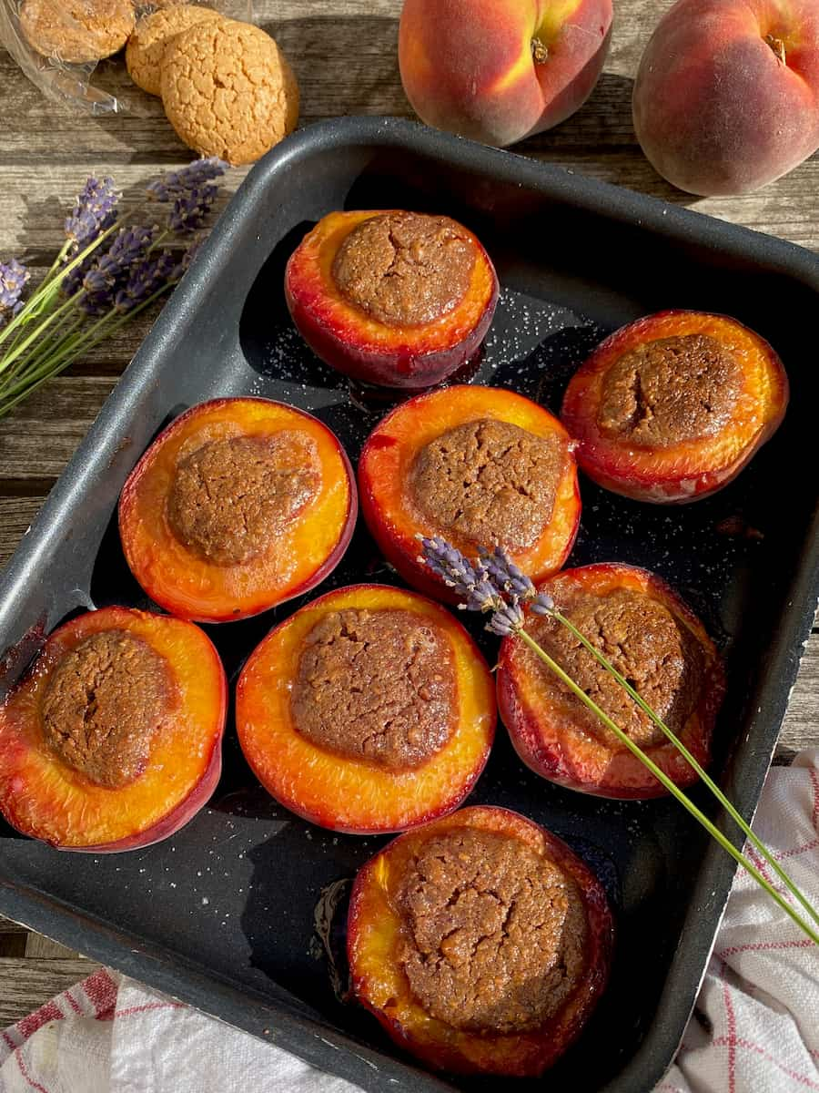 baked peach halves stuffed with almond filling and topped with lavender flowers