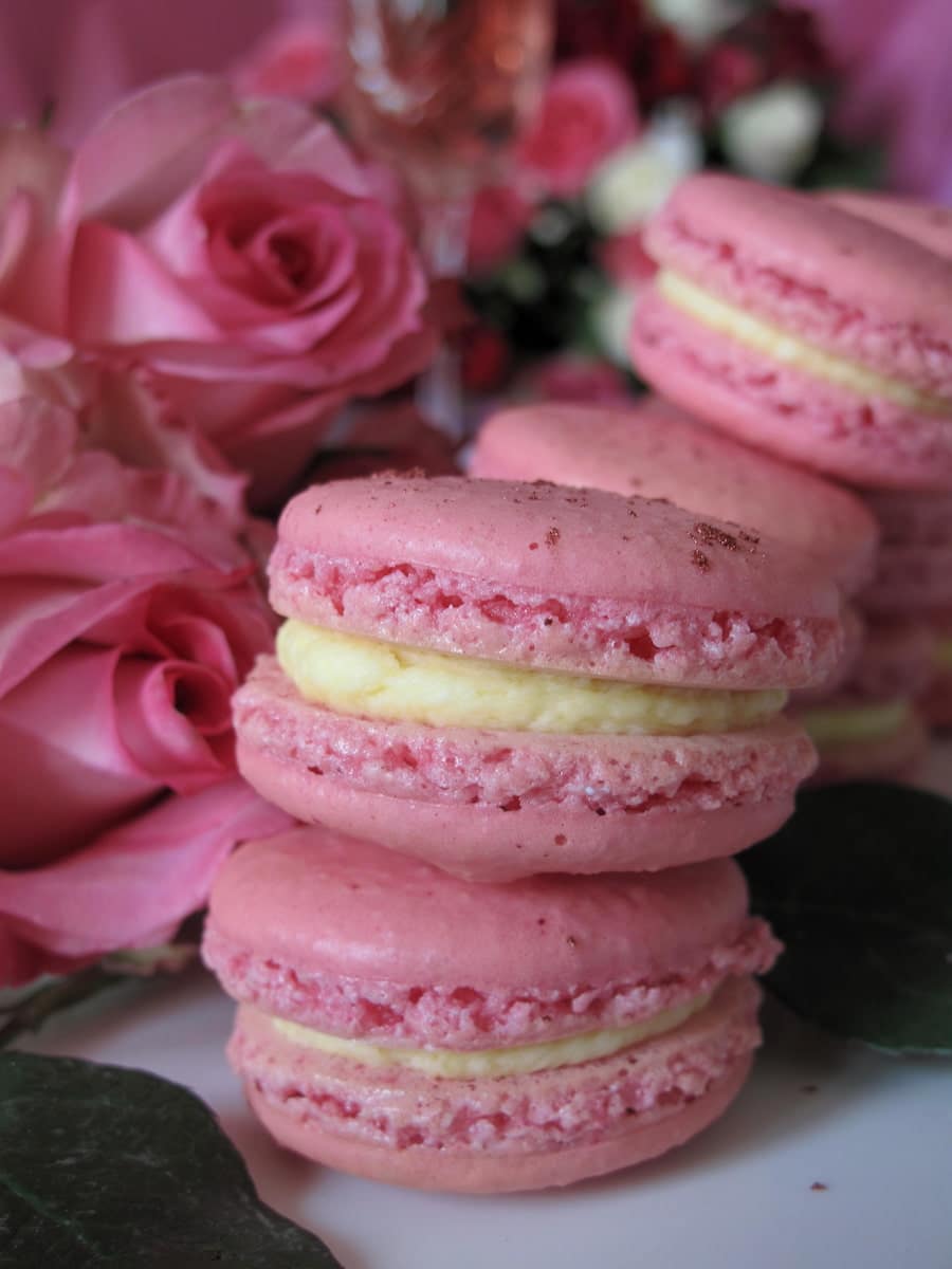 pastel pink macaron sandwiched cookies with rose flowers