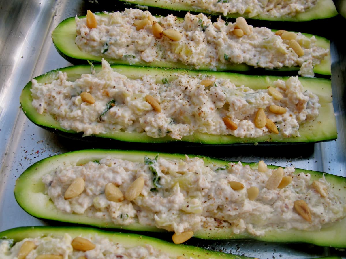 stuffed courgettes with creamy cheese and mint about to bake in the oven