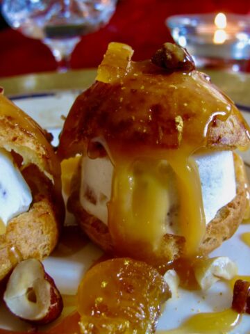 choux buns filled with nougat ice cream and dribbling caramel candle cosy atmosphere