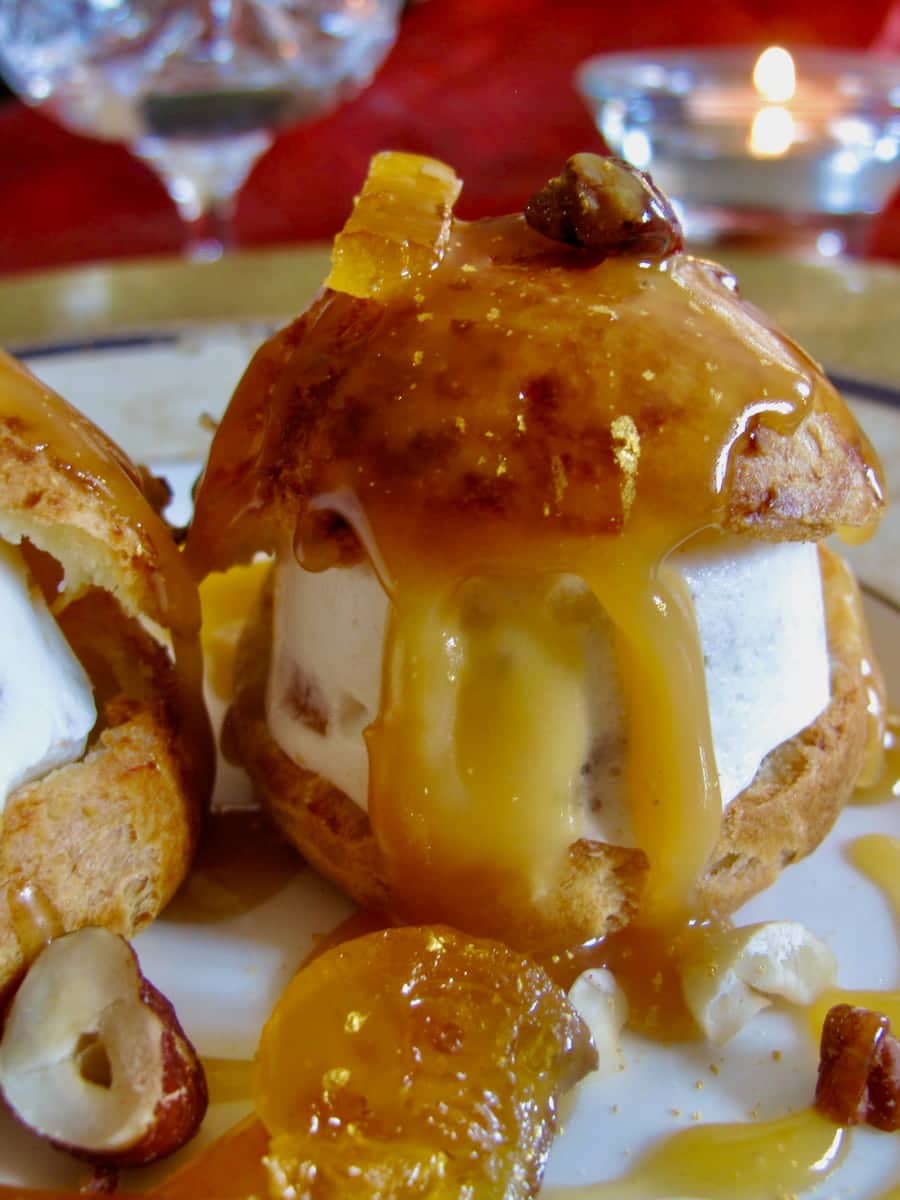 filled choux buns with golden caramel sauce 