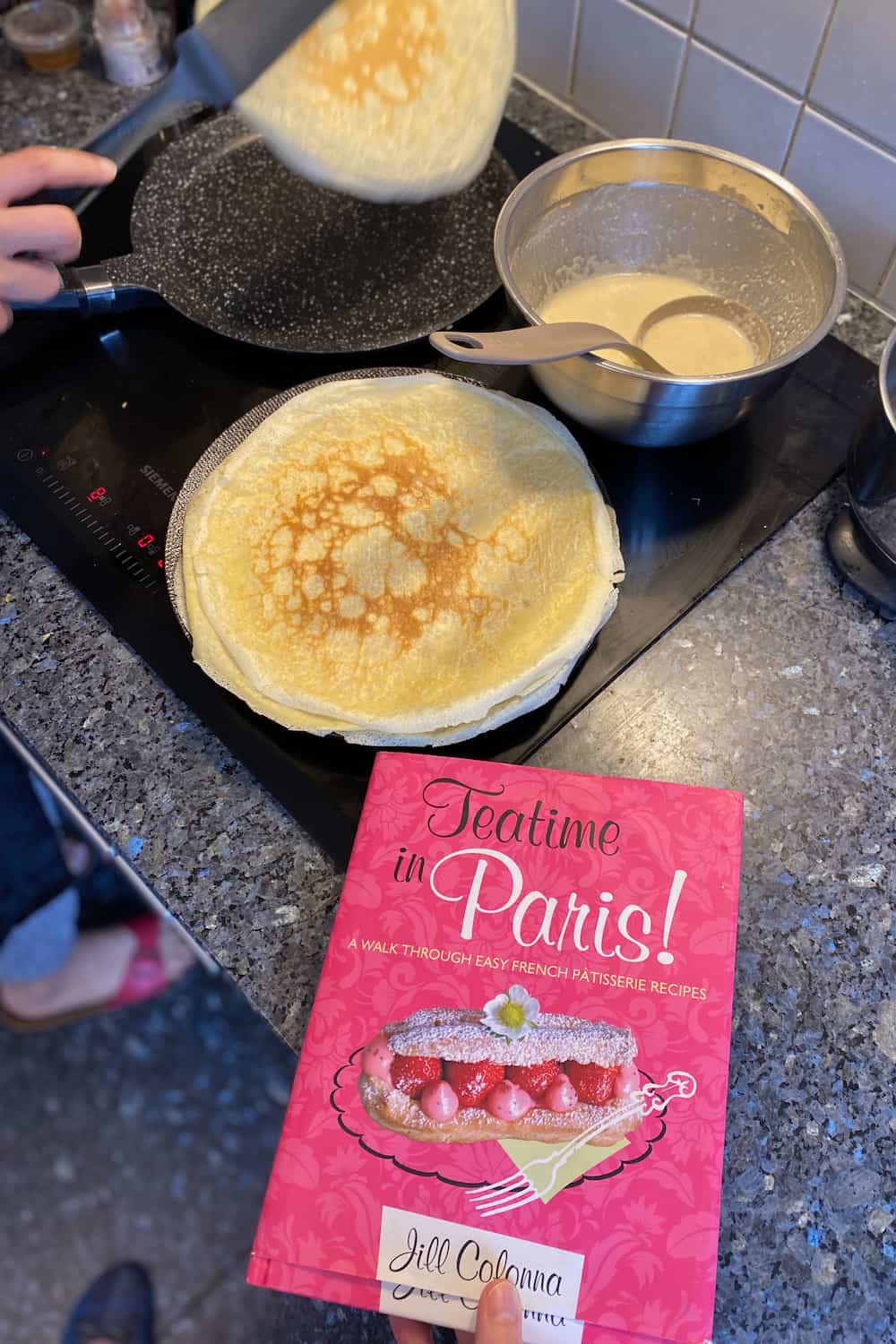 making thin crepe pancakes from the book, Teatime in Paris