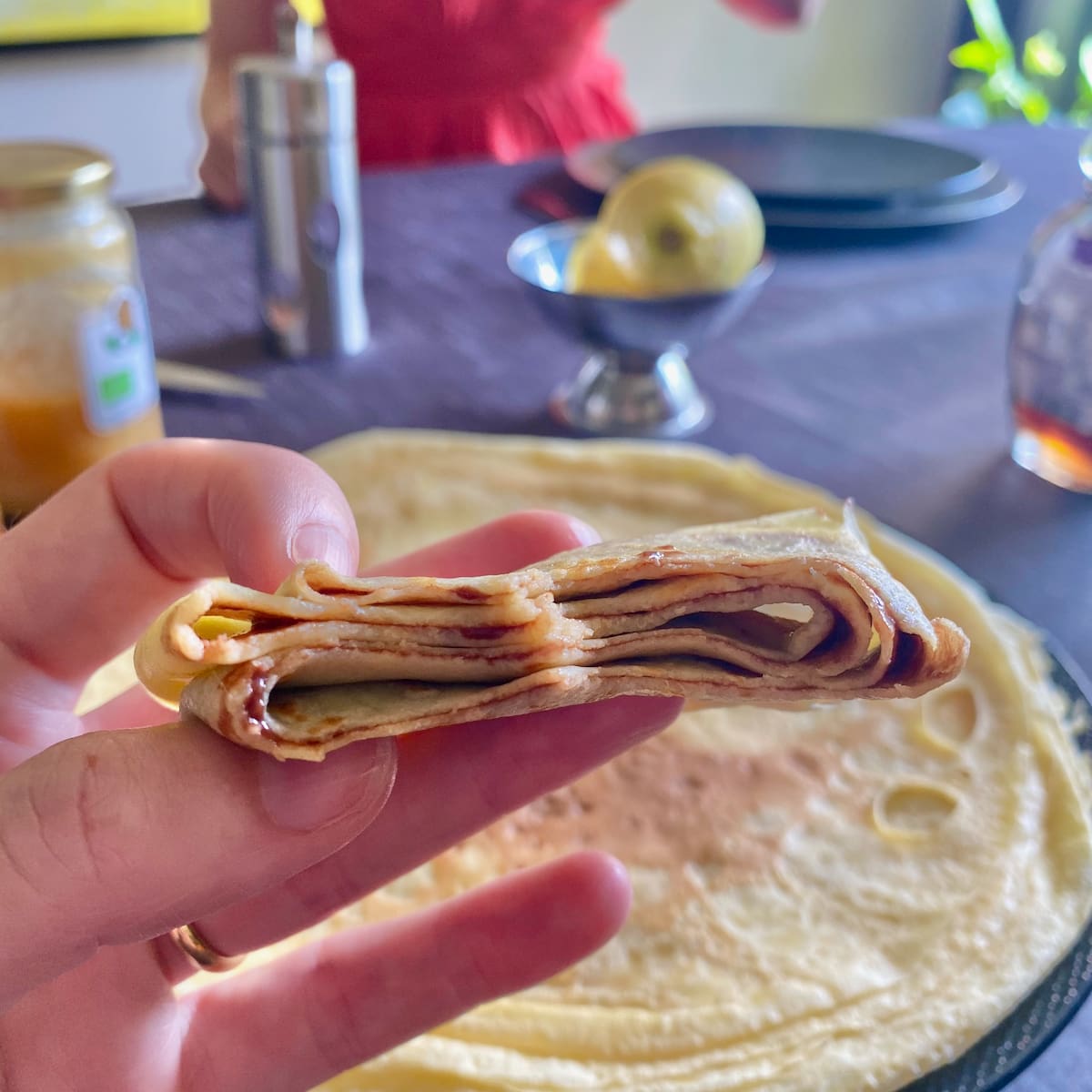 thin French crepe pancake folded over on itself, revealing a little chocolate spread inside