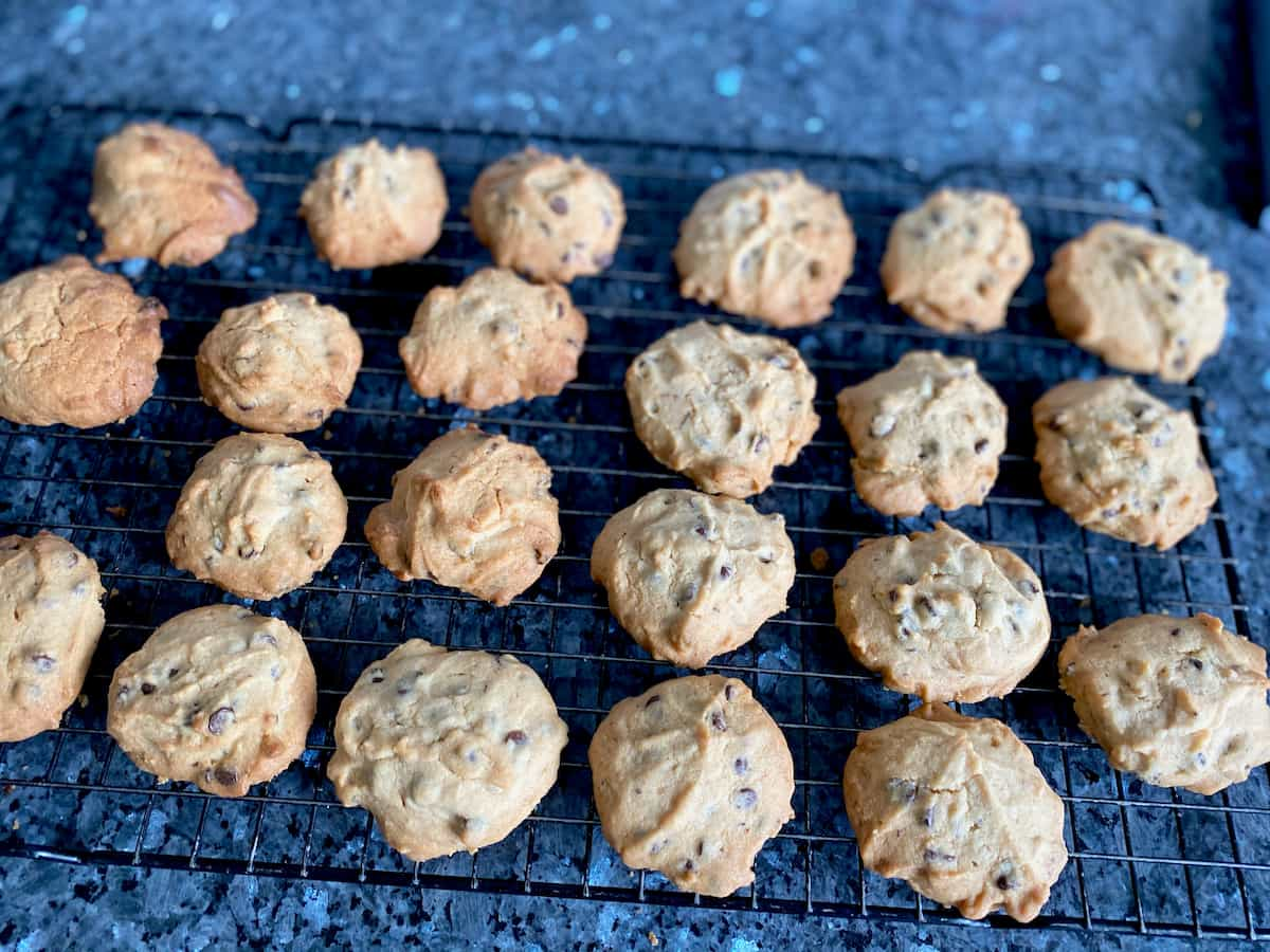 rows of golden cookies cooling on a rack