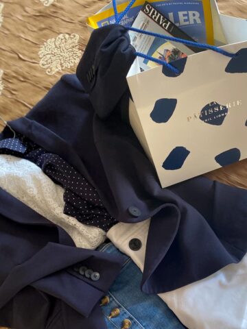 blue and white coordinating outfit with a spotted blue and white patisserie bag
