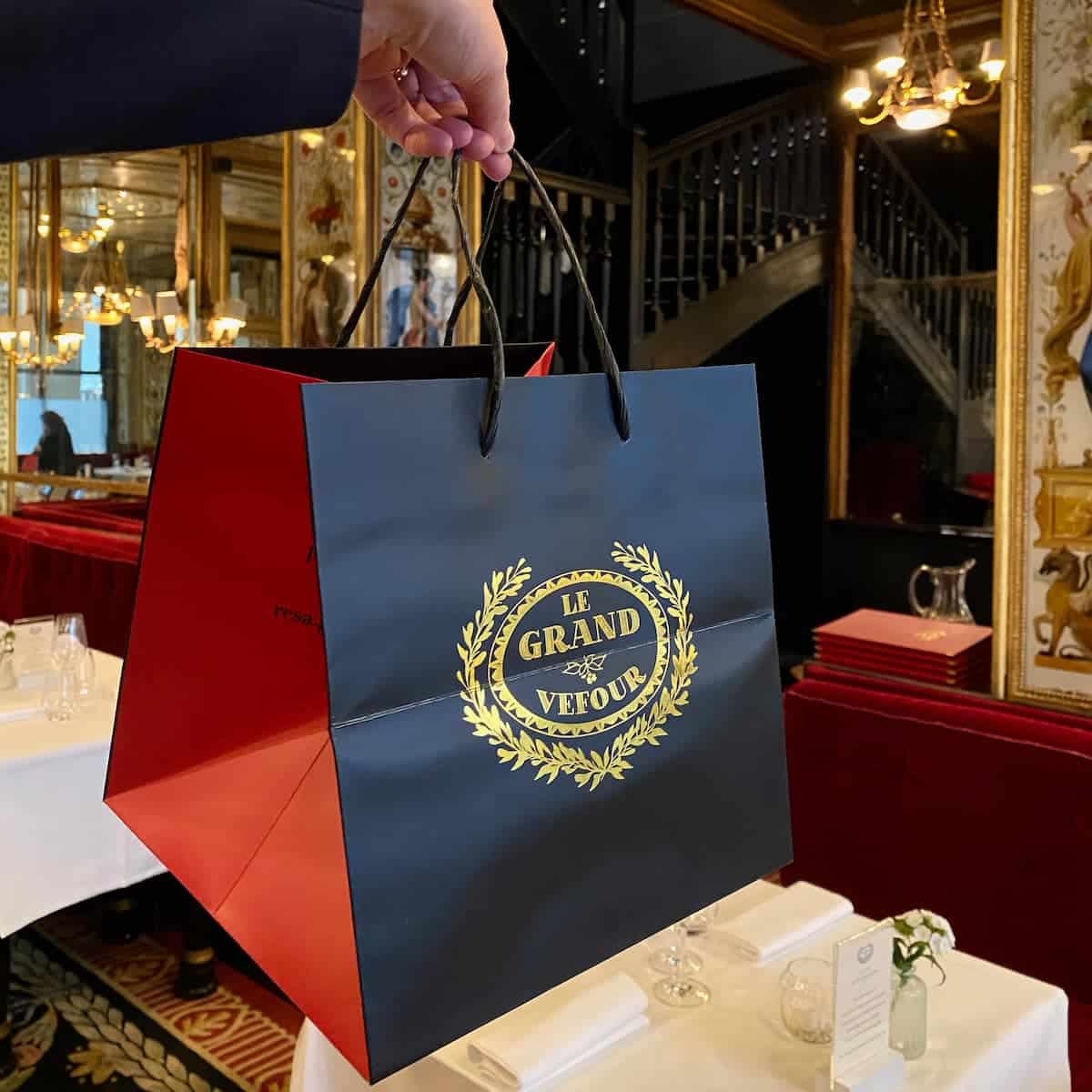 black red and gold bag in Paris