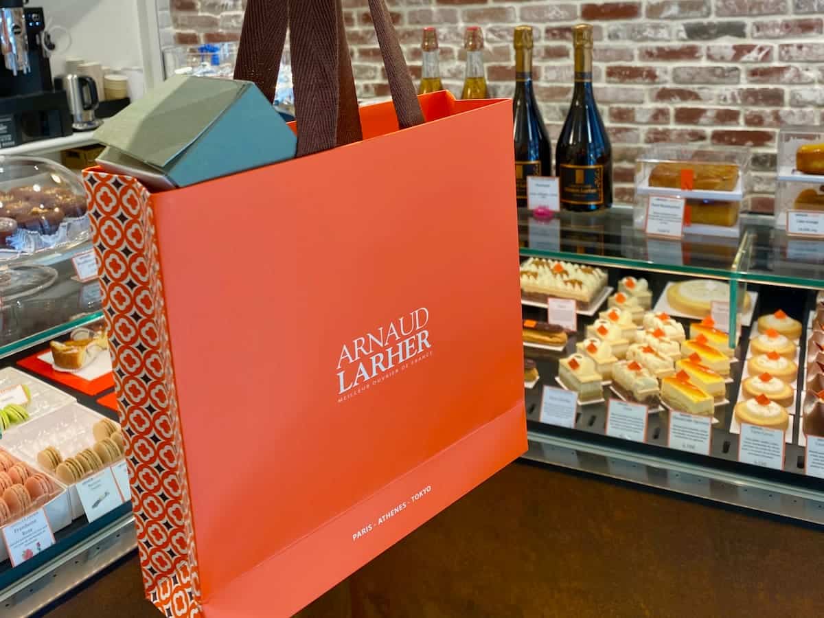 orange patisserie bag with brown handles for Paris macarons