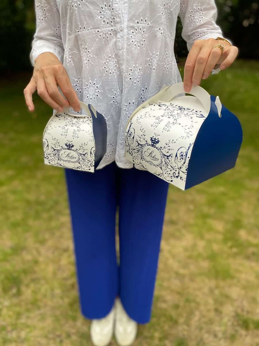 blue and white pastry boxes with clothes to match