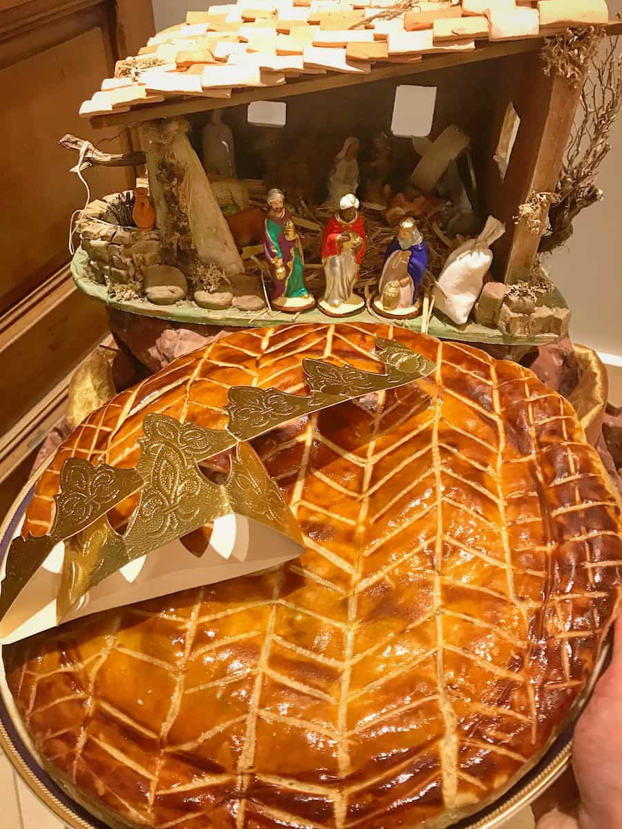 galette des rois French cake in front of a creche for epiphany