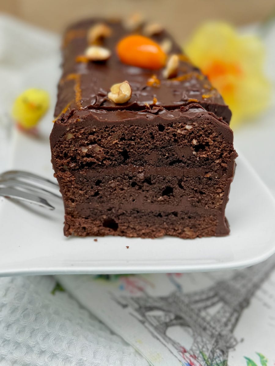 close-up of a layered chocolate cake with moist layers of ganache