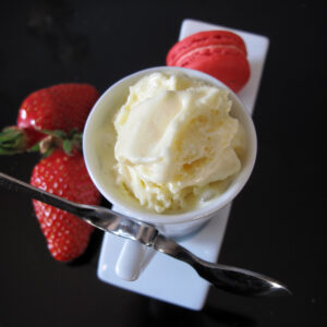 cup of lemon ice cream with strawberries