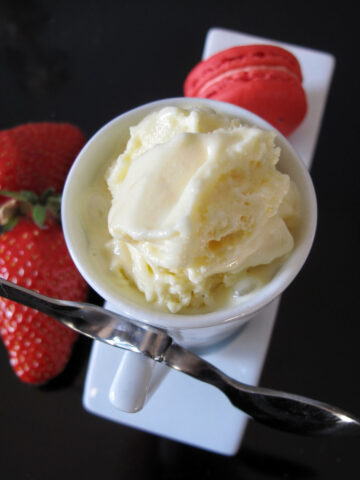 cup of lemon ice cream with strawberries