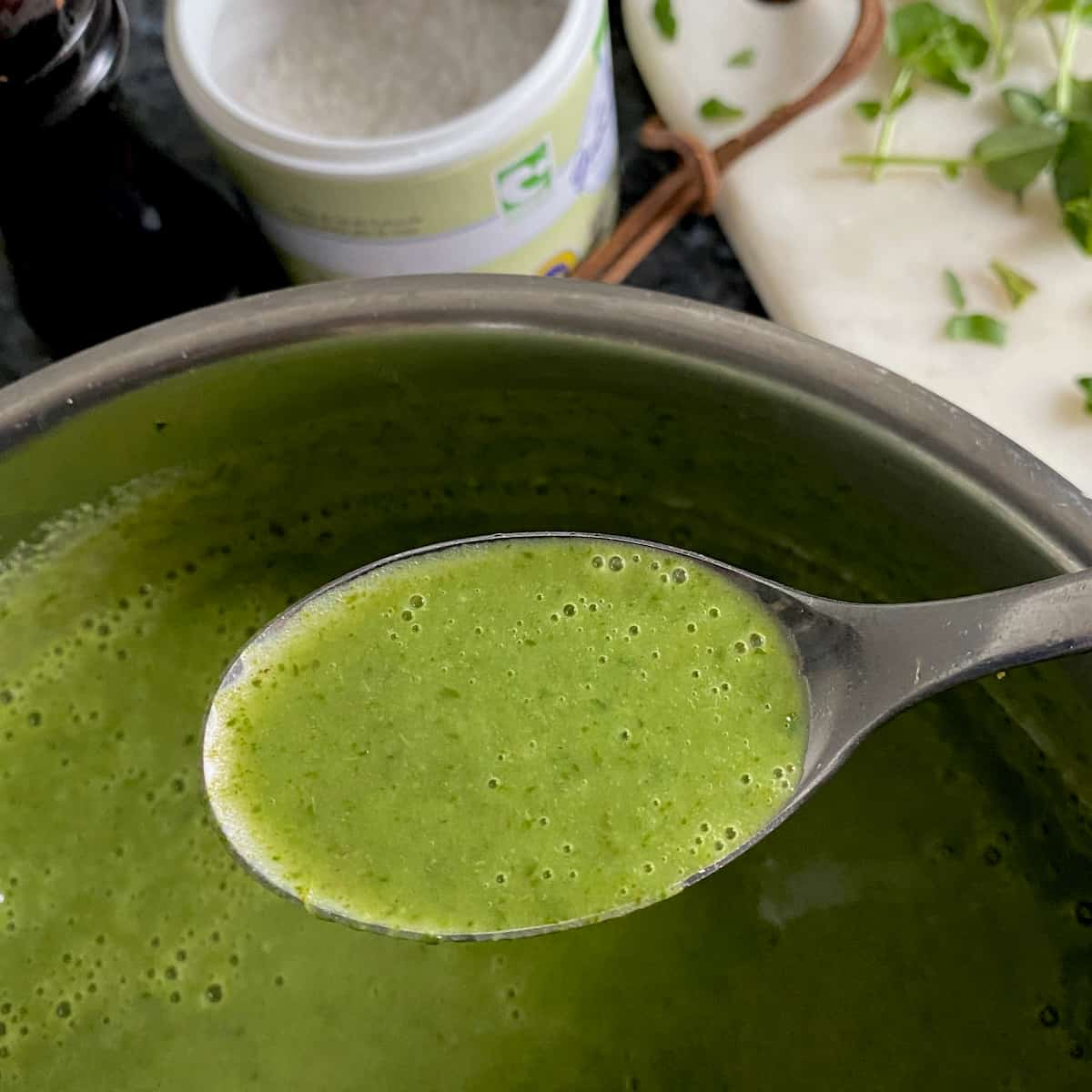 spoonful of watercress soup before seasoning