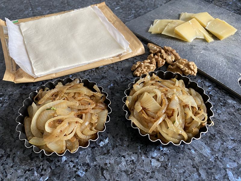 Making little tartlets with caramelized onions