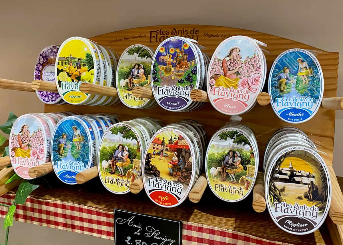 brightly coloured oval tins of French sweets or candies