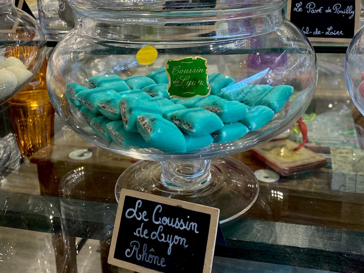 coussins de Lyon sweet speciality turquoise blue candies in a giant glass jar