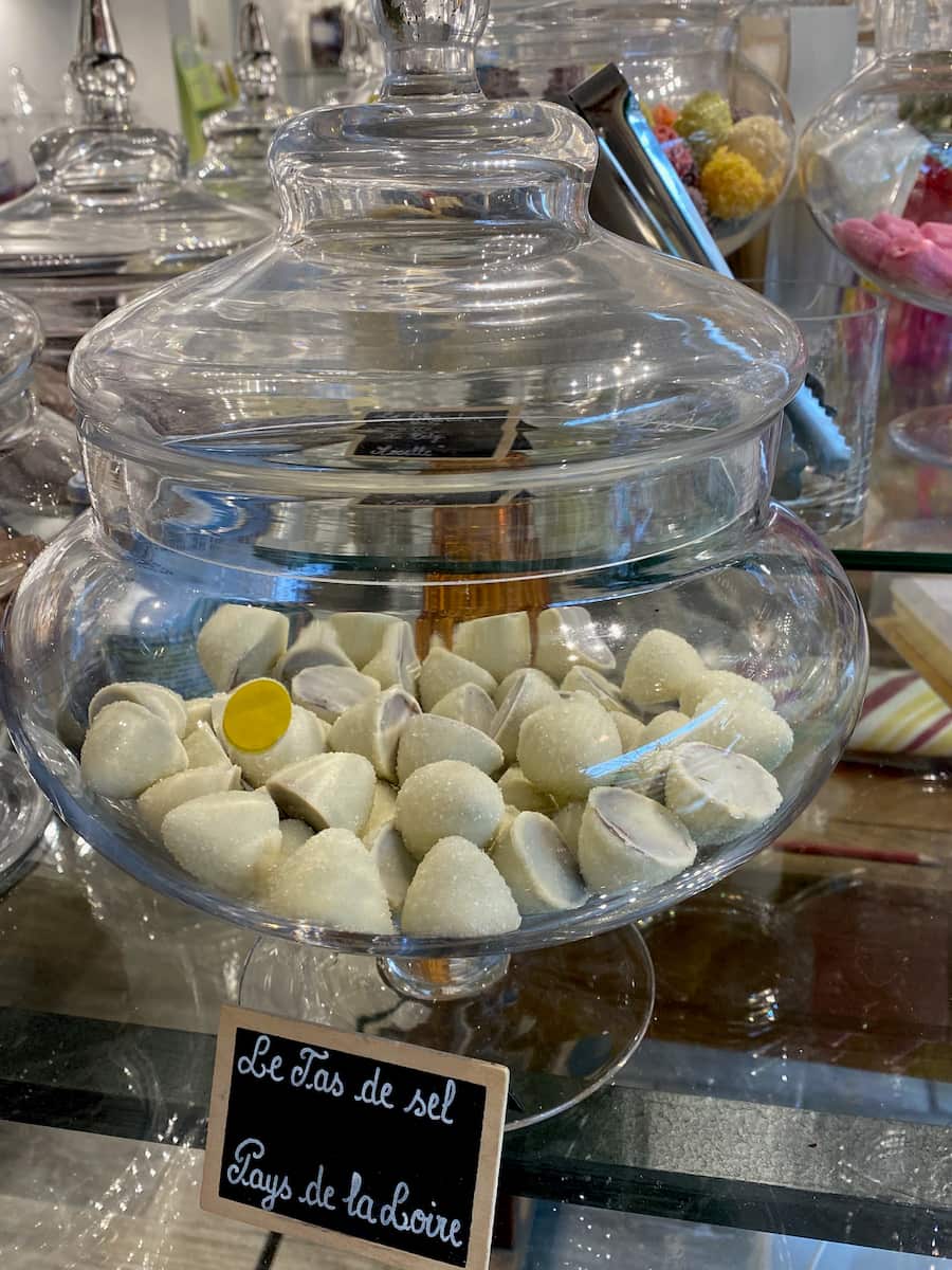 glass jar with white chocolate domed candies
