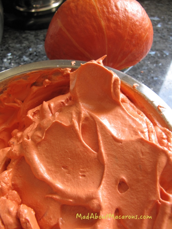 Colouring the meringue for making pumpkin macaron shells