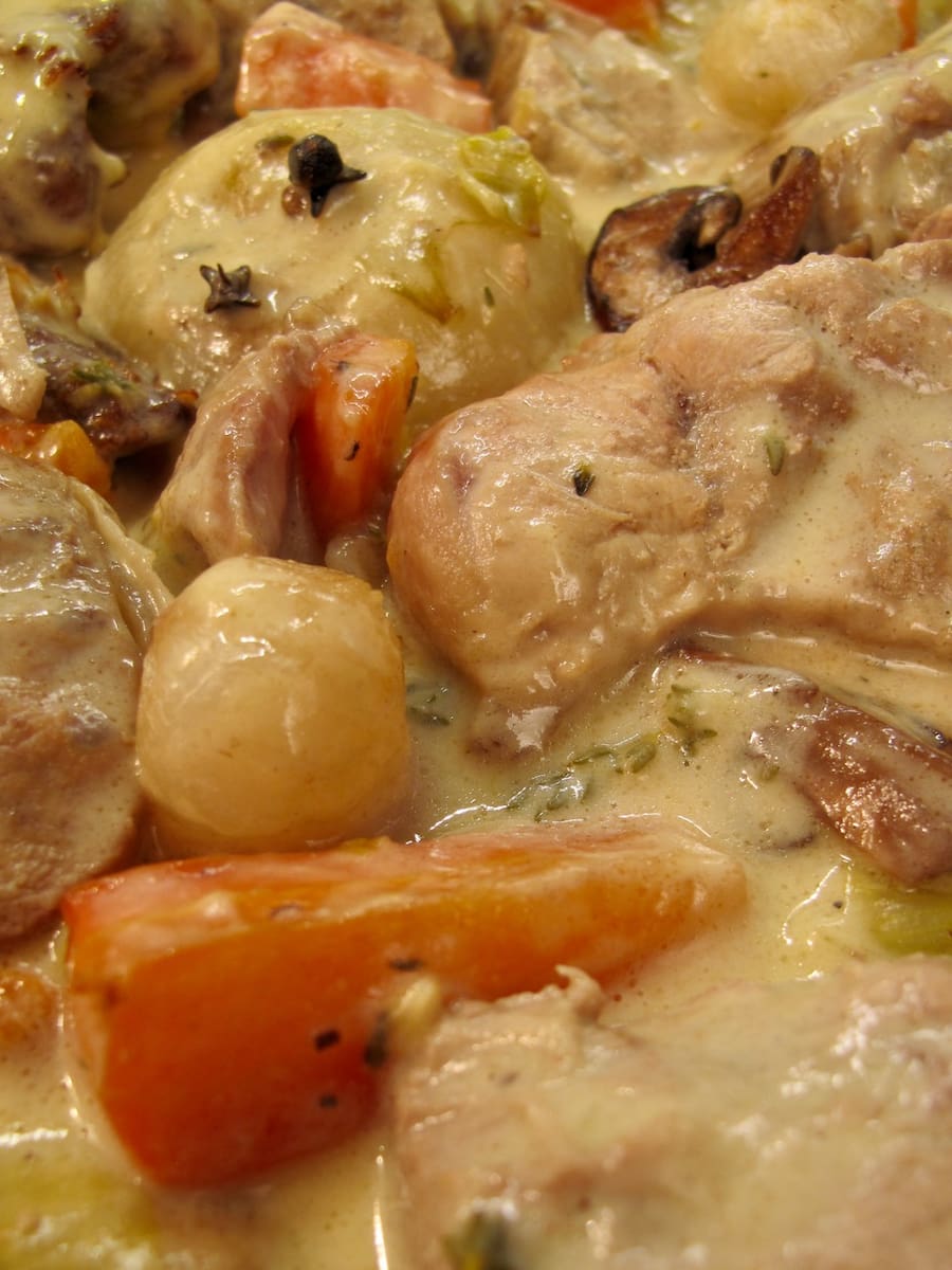veal stew in white sauce with vegetables