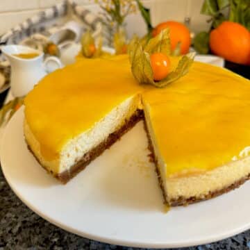 baked orange cheesecake topped with mango coulis