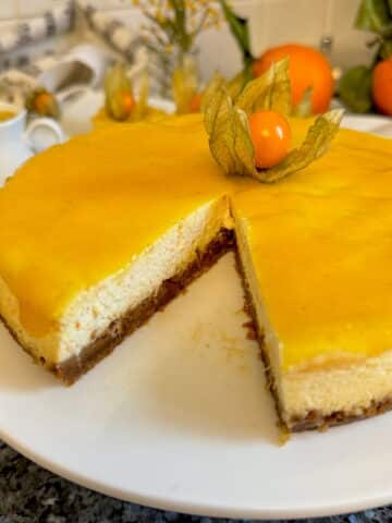 baked orange cheesecake topped with mango coulis