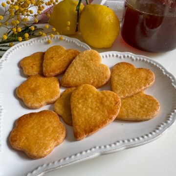 honey biscuits or cookies, golden, glazed and in love heart shapes