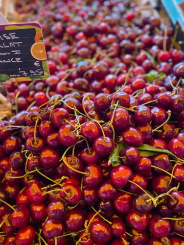 French cherries piled high at the market