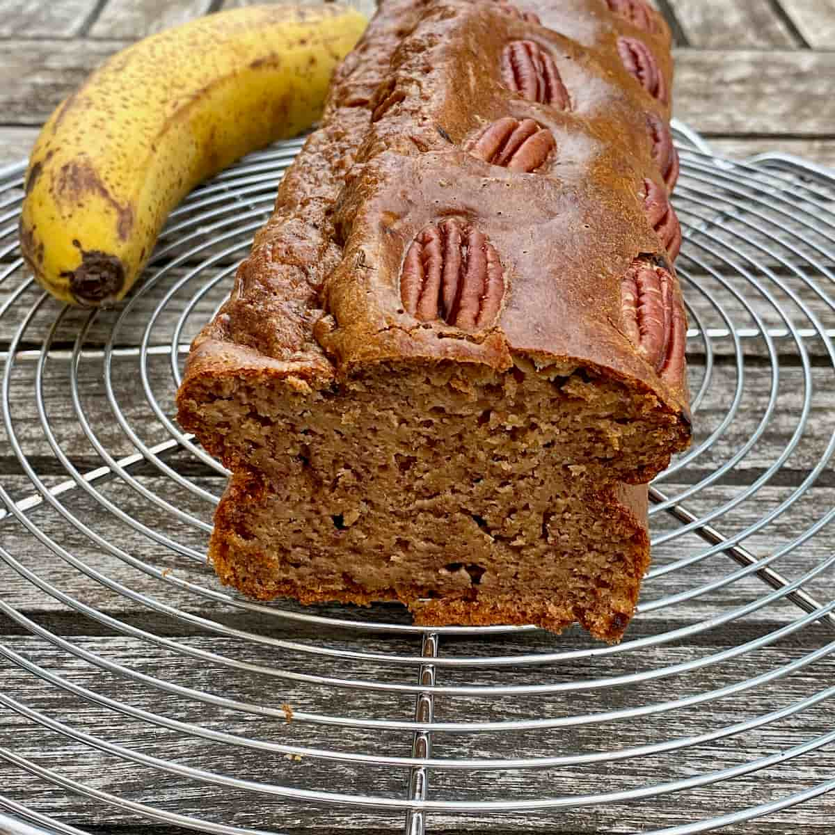 moist banana coffee cake topped with pecans