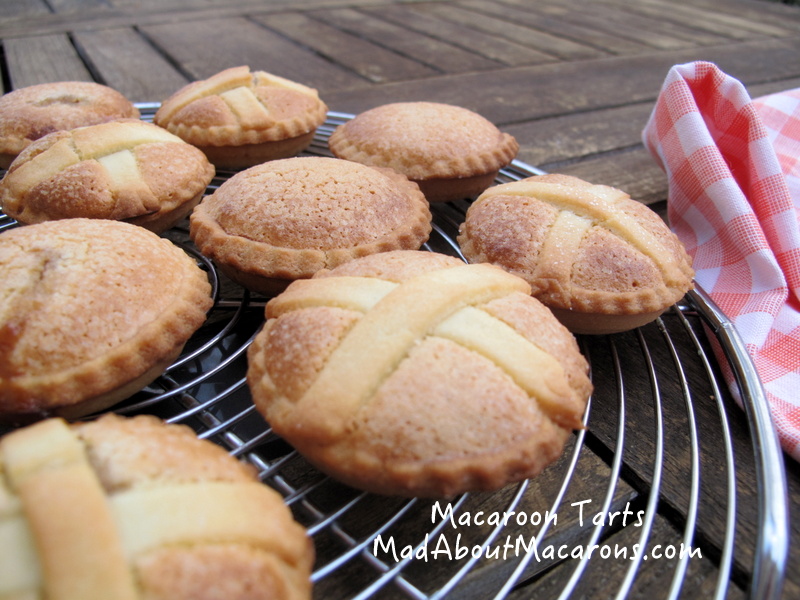 Macaroon raspberry tarts cooling on baking tray