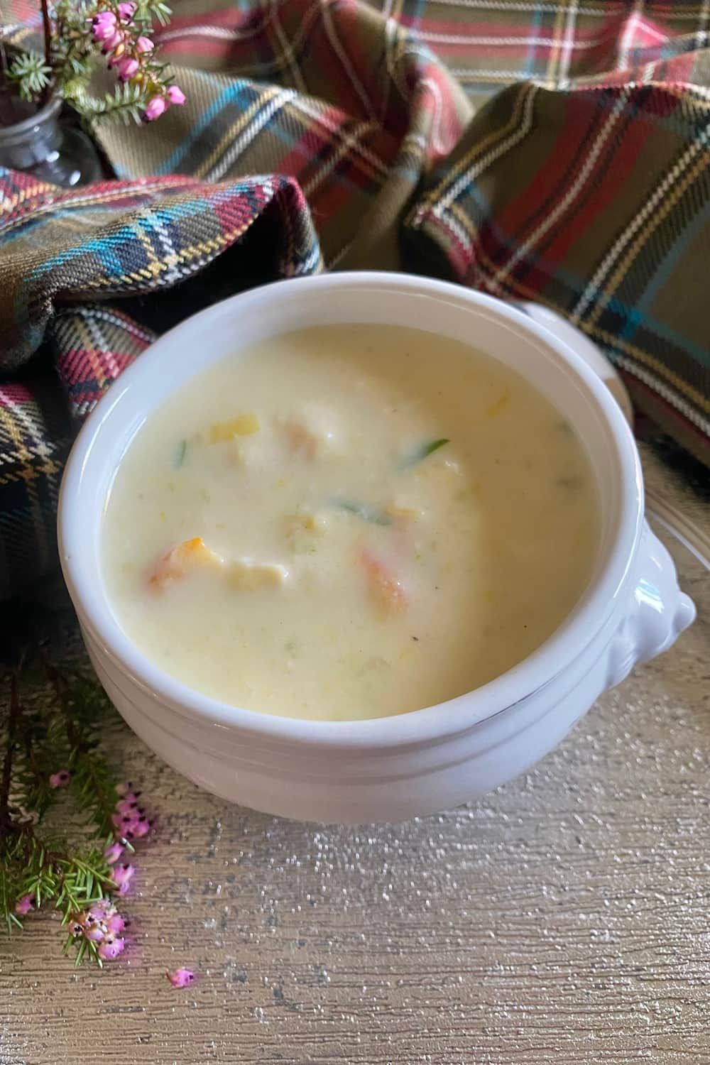 lion bowl of Cullen Skink fish chowder with tartan and heather
