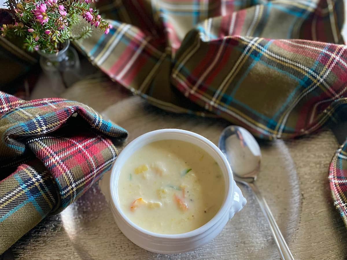 bowl of soup surrounded by tartan cloth