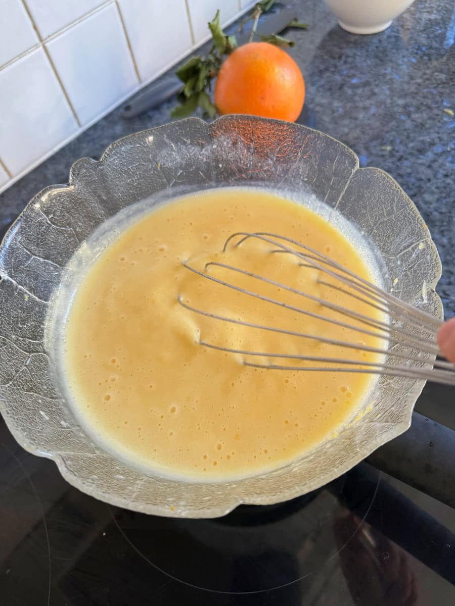 thickening curd by whisking over a double boiler 