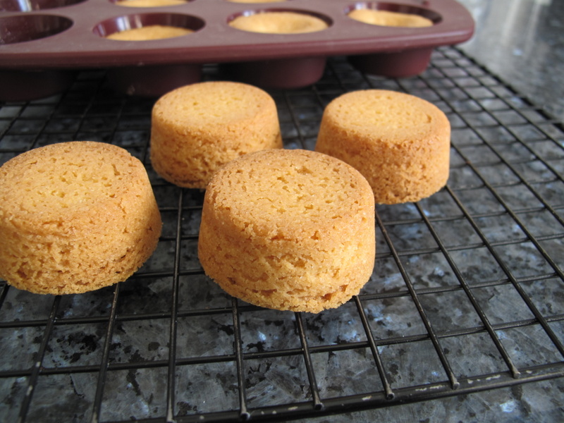 high round butter cookies with air holes on a rack to cool out of the moulds