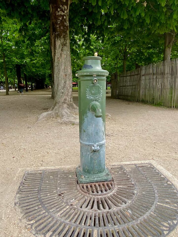 Historical Parisian fountain with drinking water in the Tuileries Garden