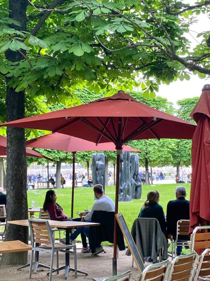outside seating with umbrellas in a paris park restaurant