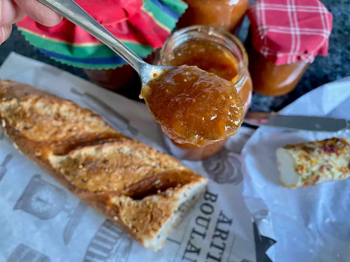 spoonful of fig jam with baguette and cheese