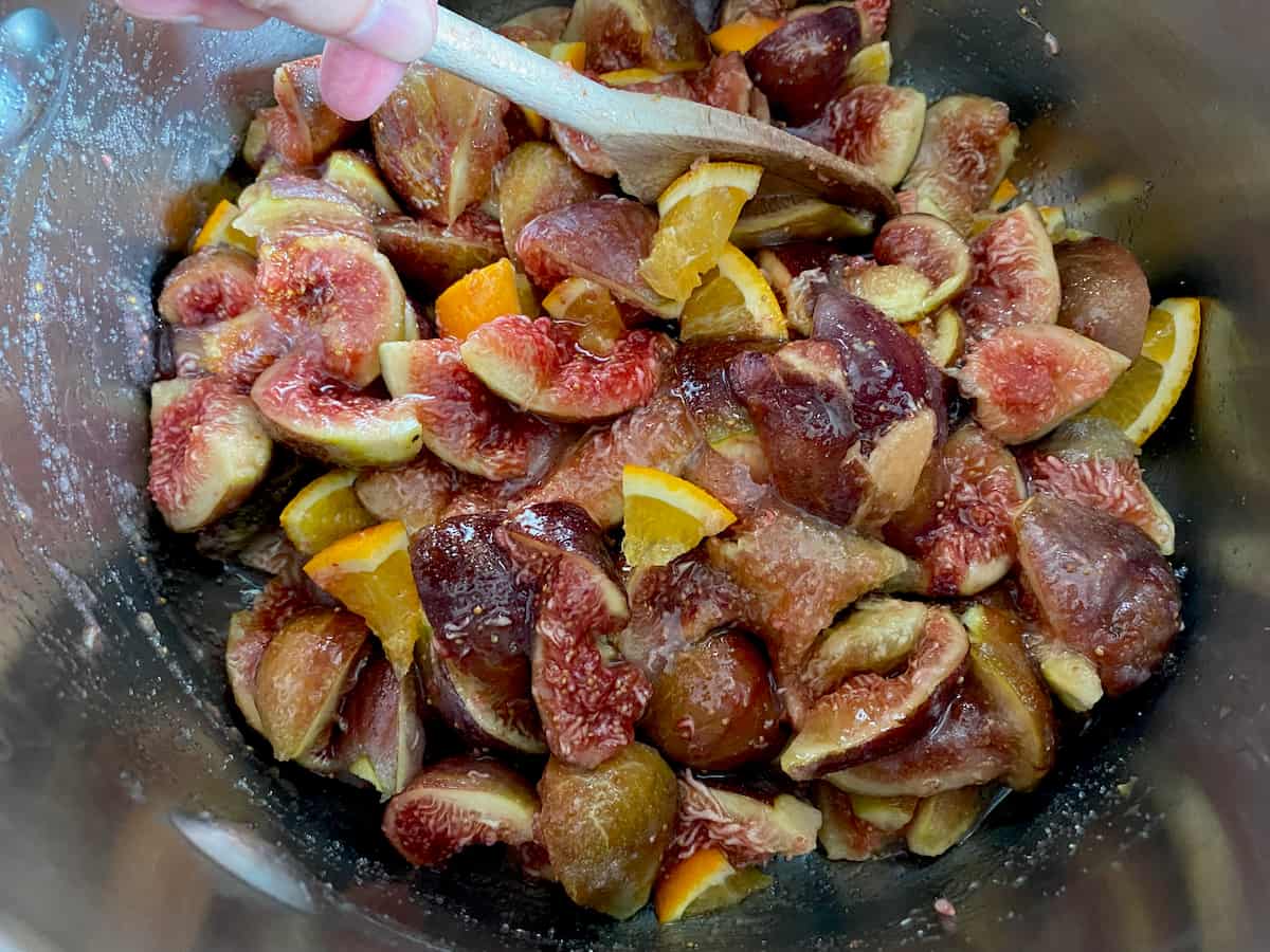 stirring chopped figs and orange in sugar