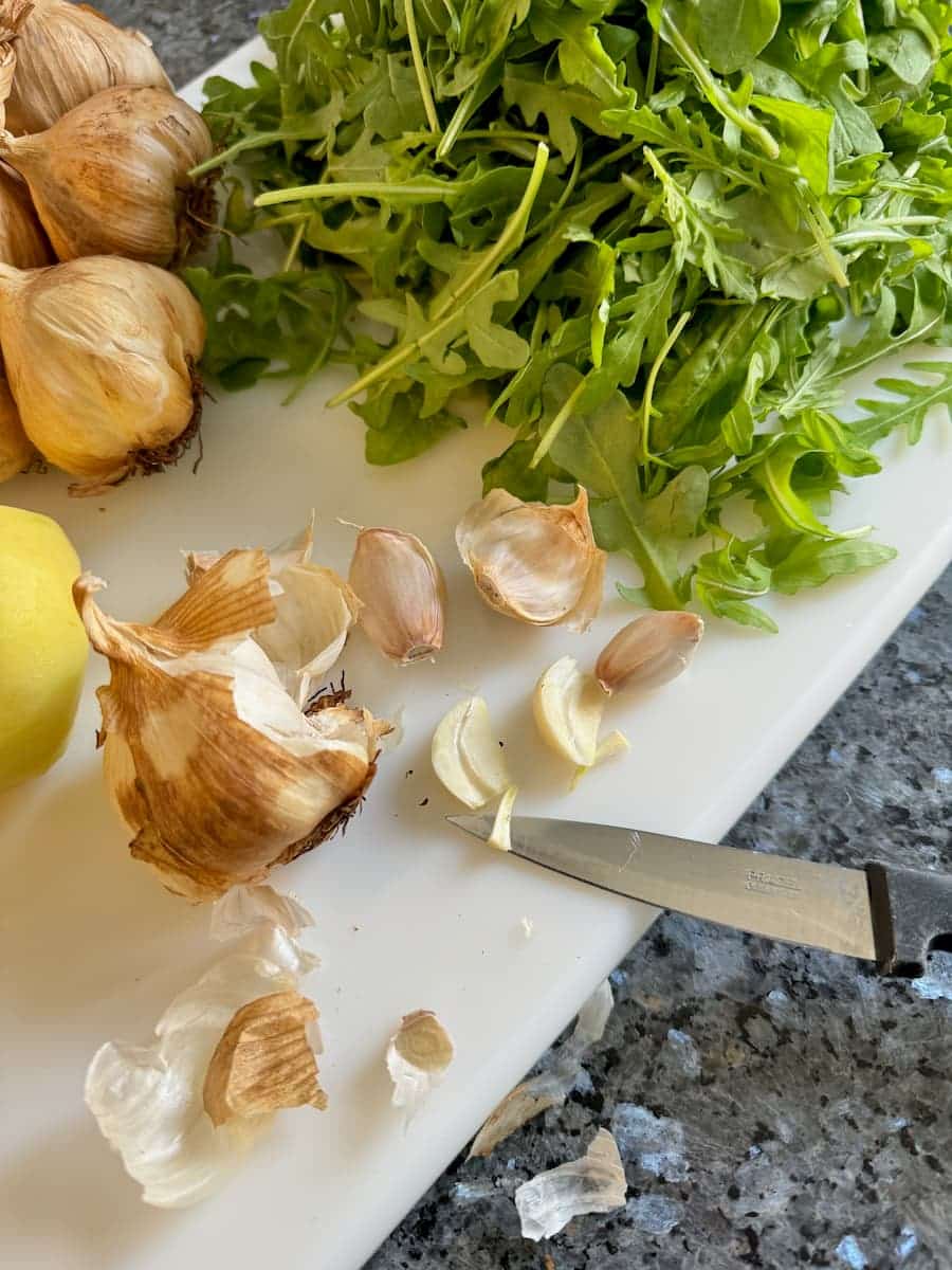 cutting the inner vein from smoked garlic cloves