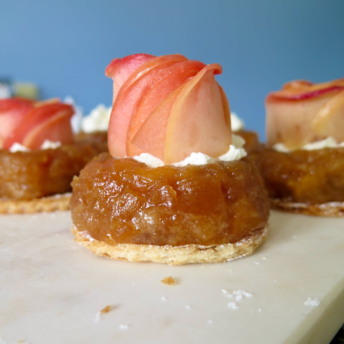 individual tarte tatins topped with pink apple roses