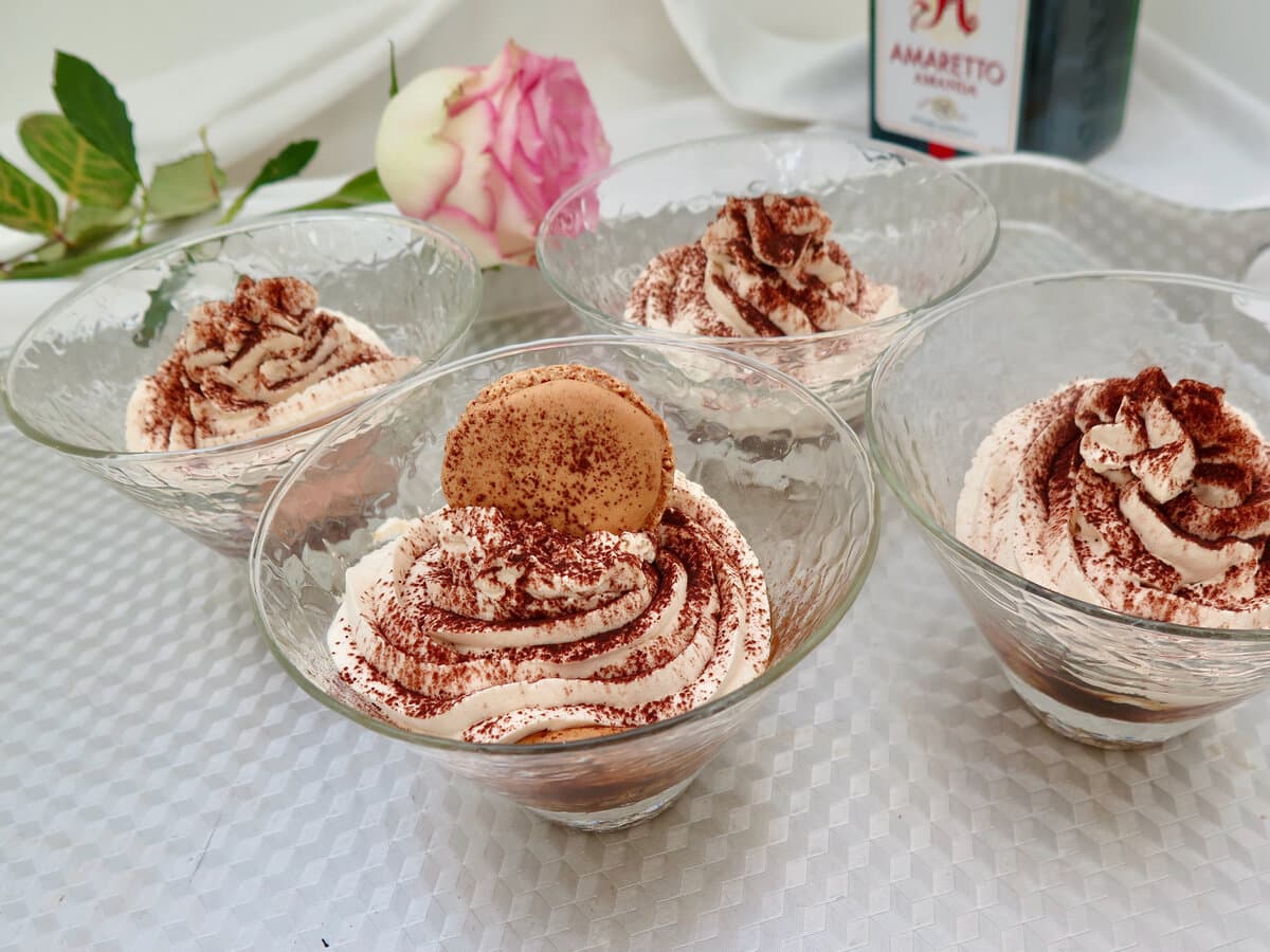 glass dishes of individual macaron tiramisu dessert