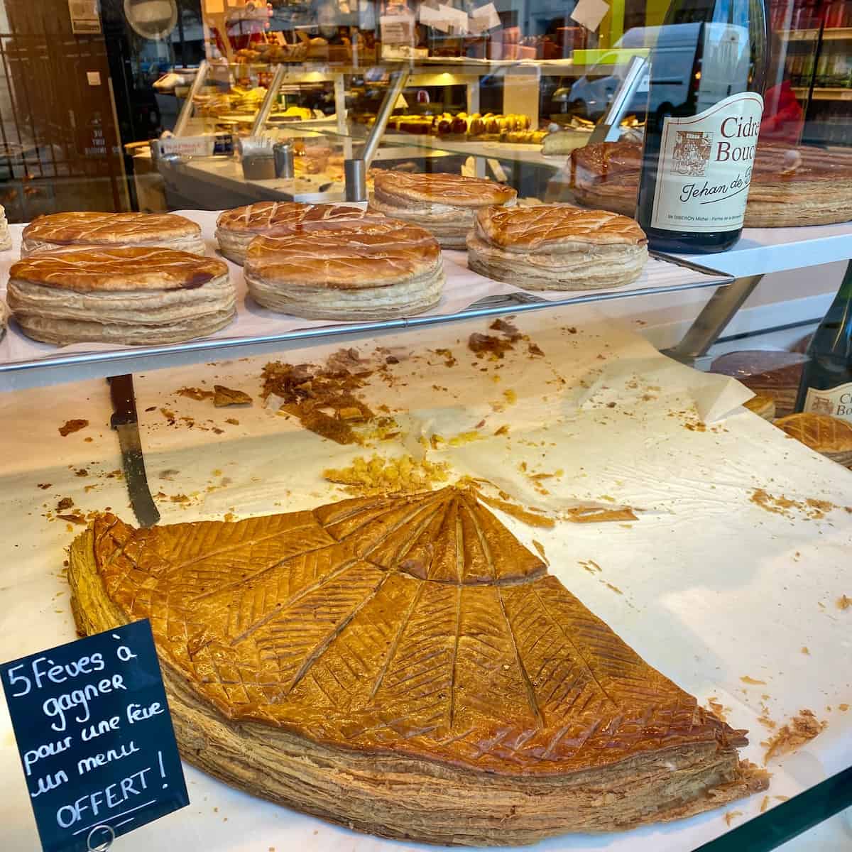 giant slice of king cake in a Paris shop window
