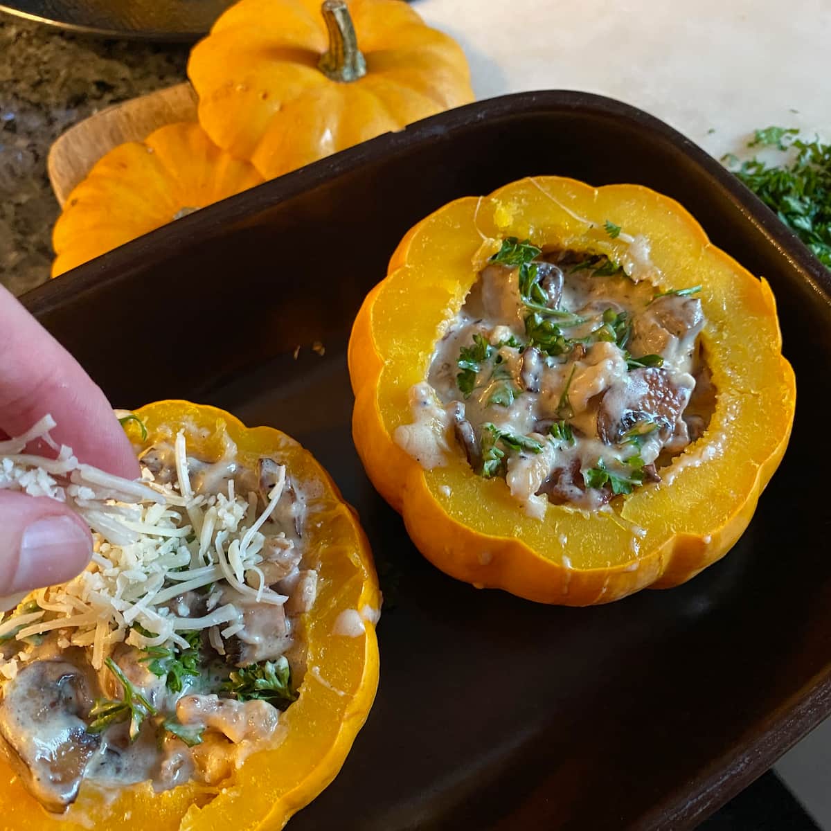 stuffing mini pumpkins with mushrooms and cheese