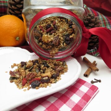 cookie jar spilling out granola next to orange and red ribbons