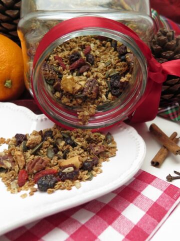 cookie jar spilling out granola next to orange and red ribbons